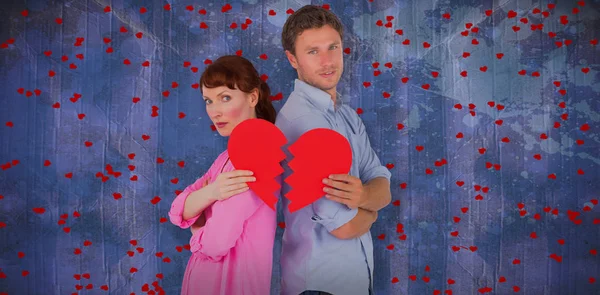 Couple holding a broken heart — Stock Photo, Image