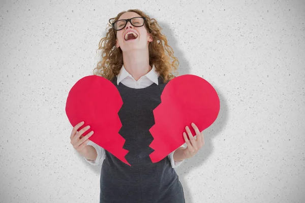 Geeky hipster holding broken heart card — Stock Photo, Image
