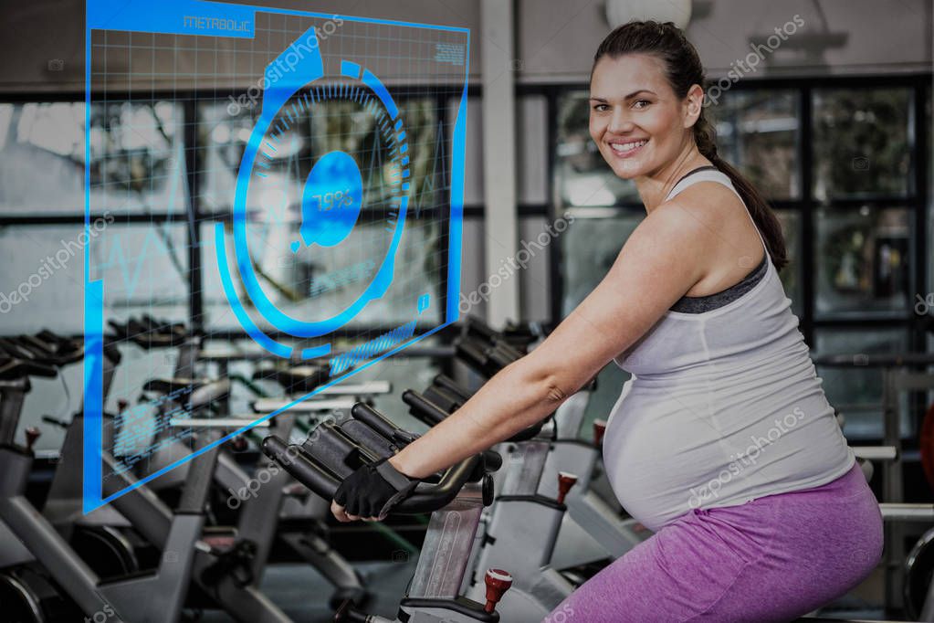 Pregnant woman using exercise bike — Stock Photo © Wavebreakmedia 140064952