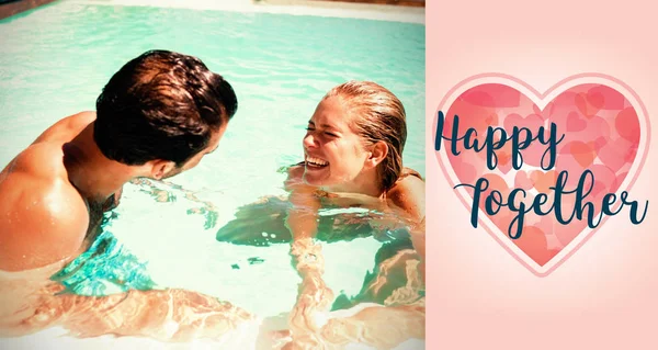 Pareja en piscina y valentines palabras — Foto de Stock