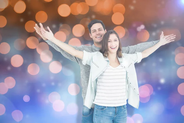 Couple embracing with arms outstretched — Stock Photo, Image