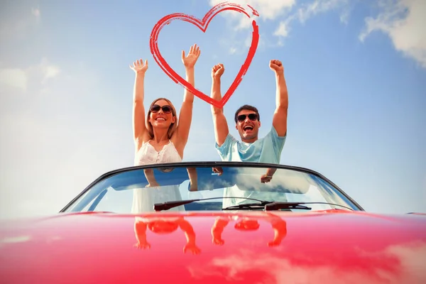 Crazy couple in red cabriolet — Stock Photo, Image