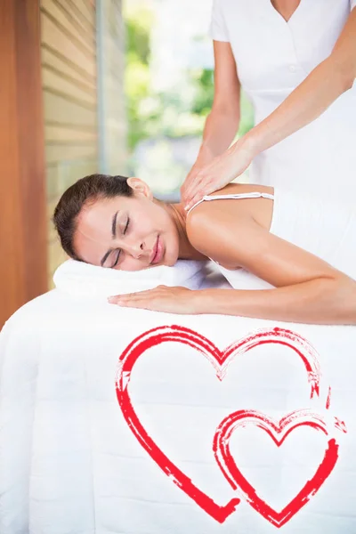 Masseur massaging woman at health spa — Stock Photo, Image
