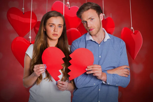 Couple holding broken heart — Stock Photo, Image