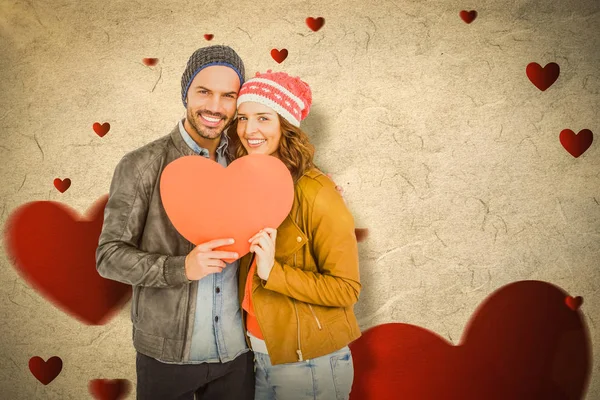 Par som håller hjärta form papper — Stockfoto
