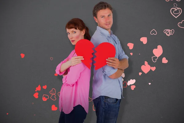 Couple holding a broken heart — Stock Photo, Image