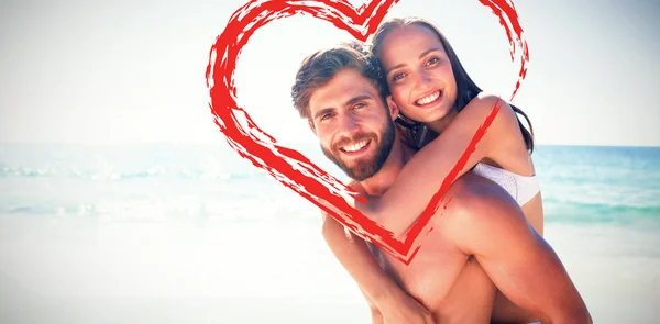 Man giving piggy back to his girlfriend — Stock Photo, Image