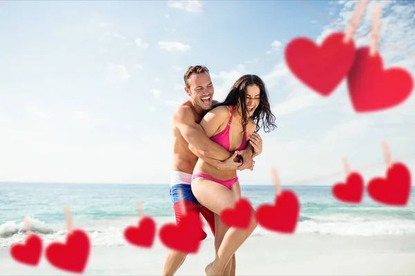 Romantic couple embracing each other on beach — Stock Photo, Image