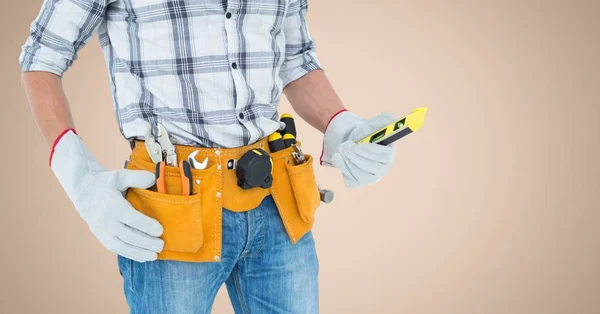 Mid-section of handy man with tool belt — Stock Photo, Image