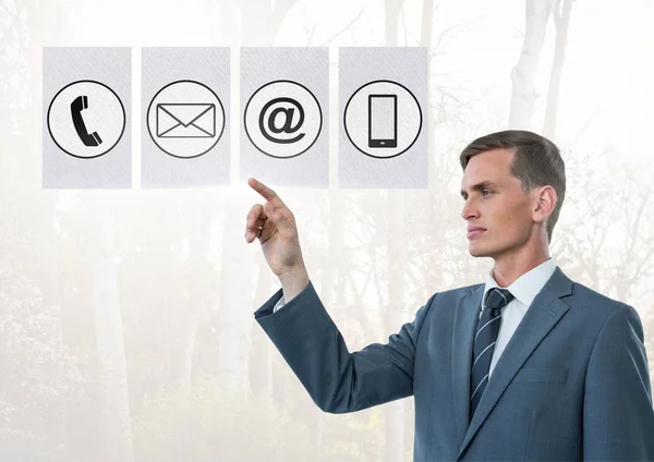 Businessman touching digitally generated connecting icons — Stock Photo, Image