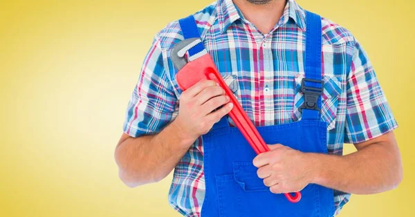 Mid section of handy man holding wrench — Stock Photo, Image