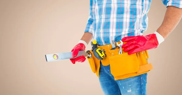 Mid section of handy man with tool belt — Stock Photo, Image