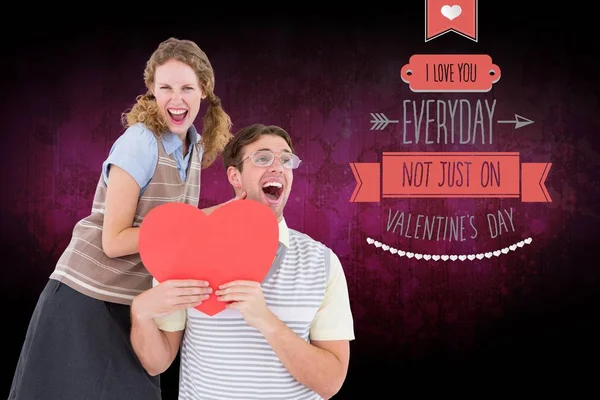 Excited couple holding heart — Stock Photo, Image