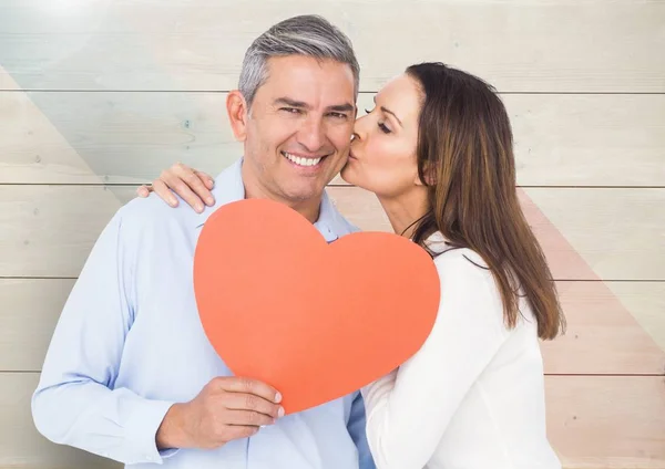 Romantic woman kissing on cheek of man — Stock Photo, Image