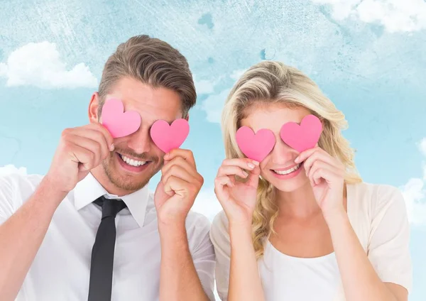 Couple hiding their eyes with heart — Stock Photo, Image