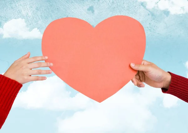 Hands holding a pink heart — Stock Photo, Image