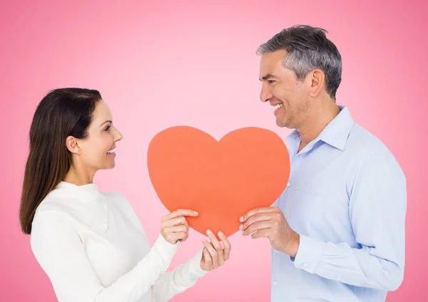 Romantic couple holding heart shape — Stock Photo, Image