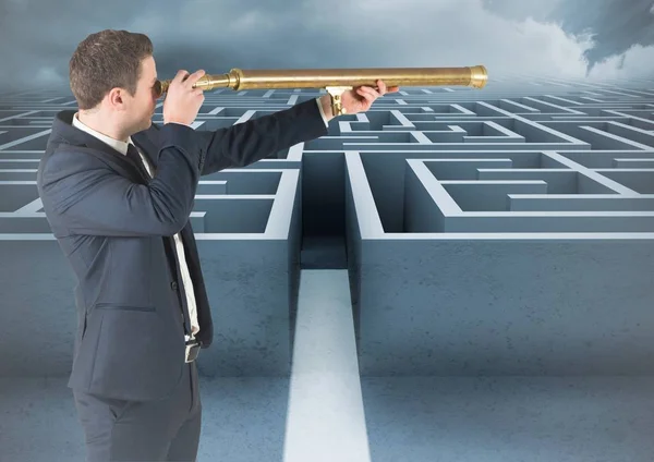Businessman with telescope looking over maze — Stock Photo, Image