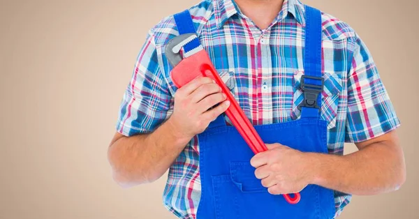 Handyman holding pipe wrench — Stock Photo, Image
