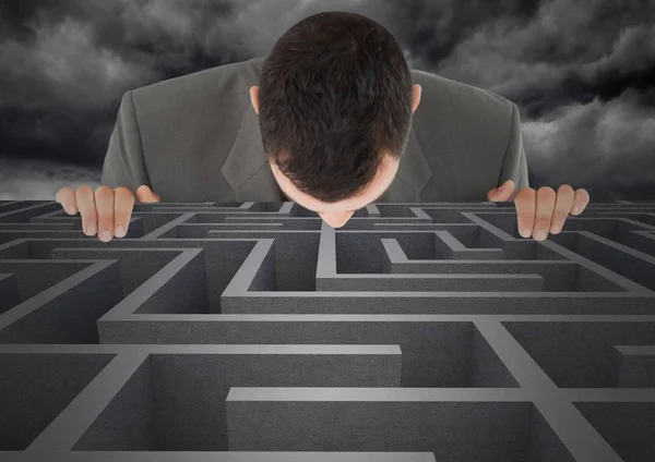 Businessman looking in maze — Stock Photo, Image