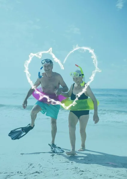 Senior couple having fun at beach — Stock Photo, Image
