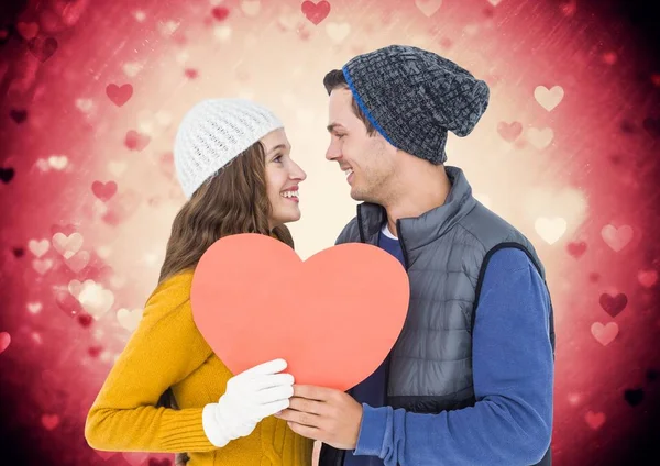 Romantic couple holding a heart — Stock Photo, Image