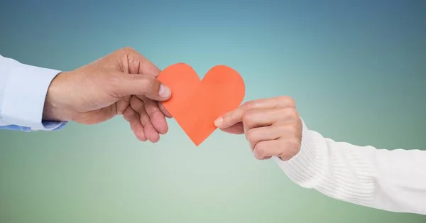 Hand of couple holding red heart — Stock Photo, Image
