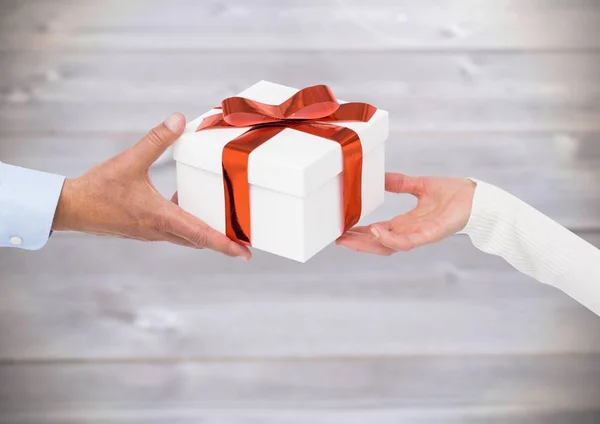 Couple hands holding gift — Stock Photo, Image