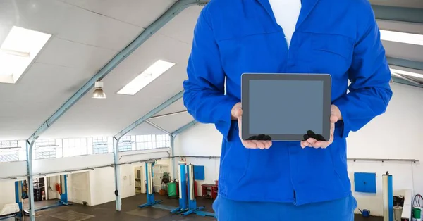 Mechanic holding digital tablet — Stock Photo, Image