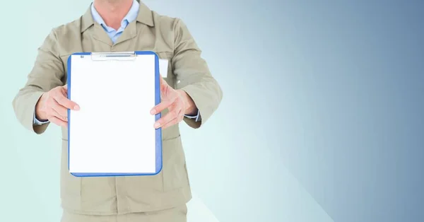 Delivery man standing with clipboard — Stock Photo, Image