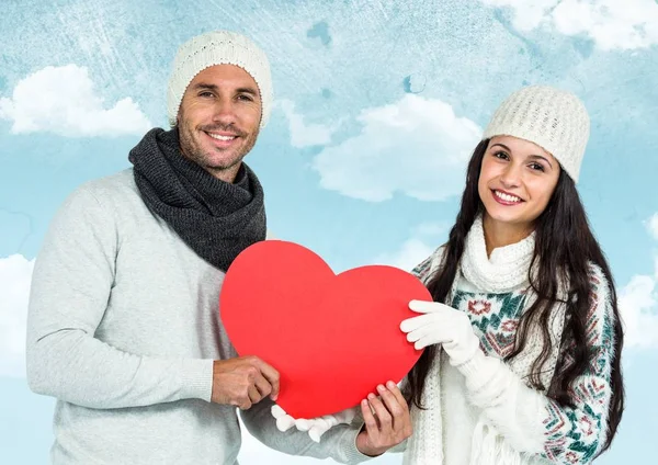 Smiling couple holding red hearts — Stock Photo, Image