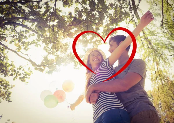 Romantic couple embracing in park — Stock Photo, Image