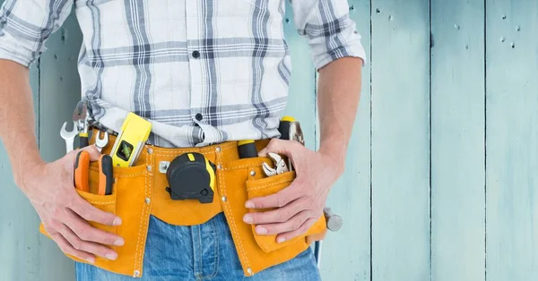 Handy man with tool belt — Stock Photo, Image