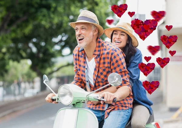 Couple having fun while driving scooter — Stock Photo, Image