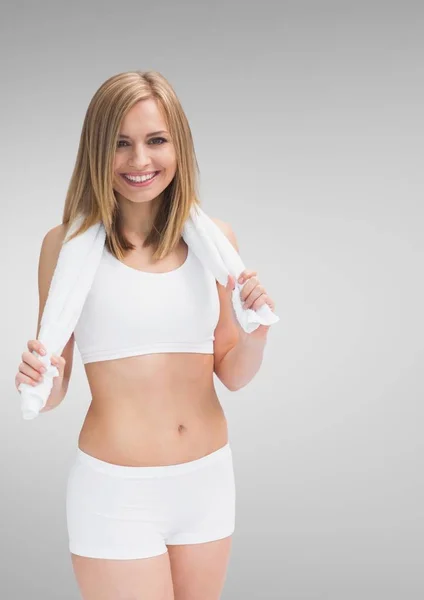 Smiling fit woman holding towel — Stock Photo, Image