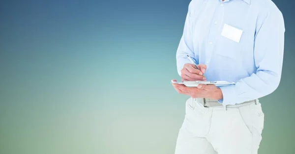 Businessman writing on clipboard — Stock Photo, Image