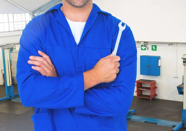 Car mechanic holding wrench — Stock Photo, Image