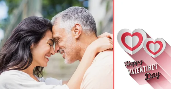 Mature couple romancing and valentine text — Stock Photo, Image