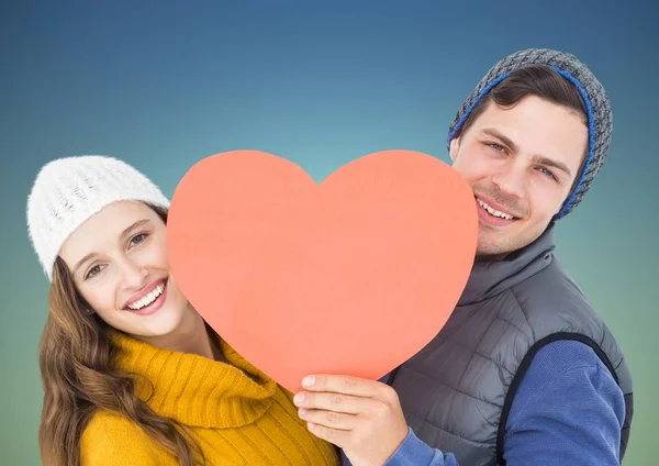 Happy couple holding a heart — Stock Photo, Image