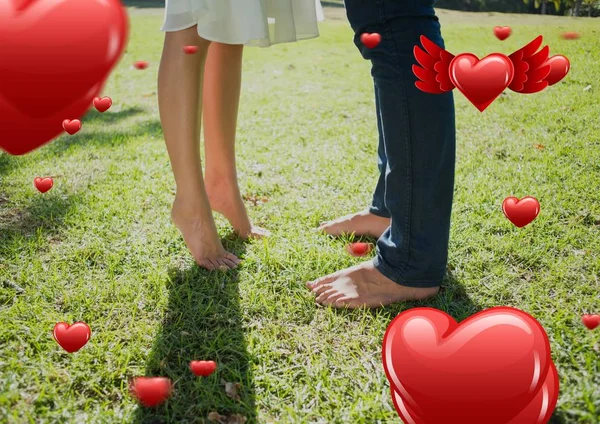 Couples legs in garden — Stock Photo, Image