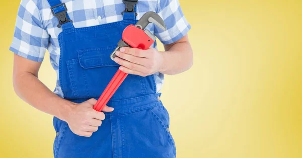 Handy man holding a wrench — Stock Photo, Image