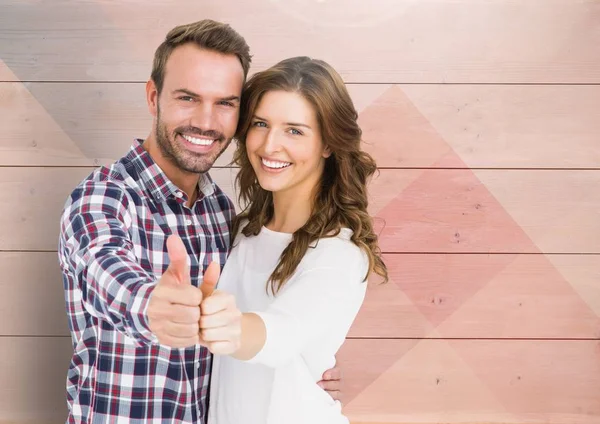 Casal mostrando polegares para cima — Fotografia de Stock