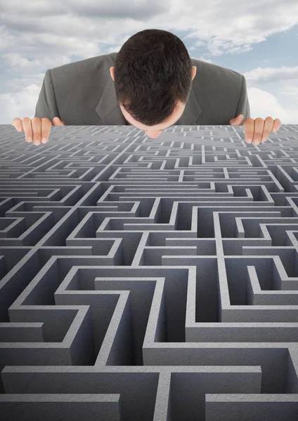 Businessman looking over maze — Stock Photo, Image