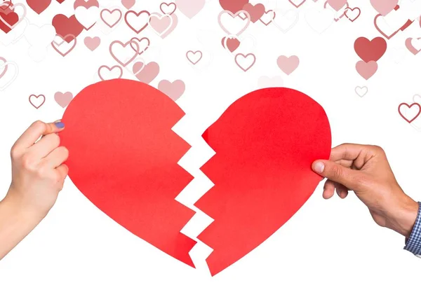 Hands of couple holding broken heart — Stock Photo, Image