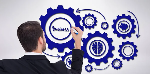 Composite image of rear view of businessman writing with marker — Stock Photo, Image