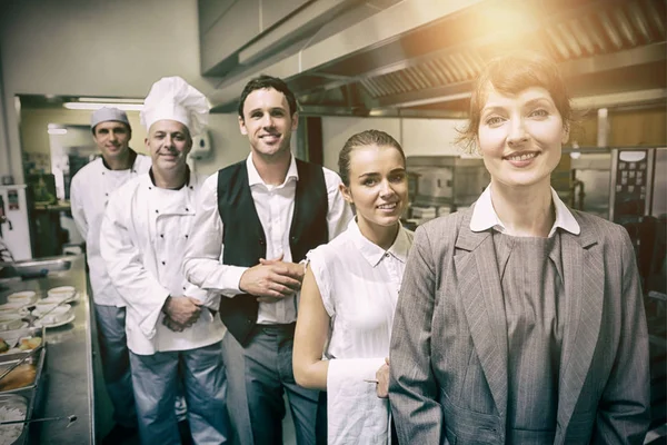 Portrait of female manager posing with staff — Stock Photo, Image