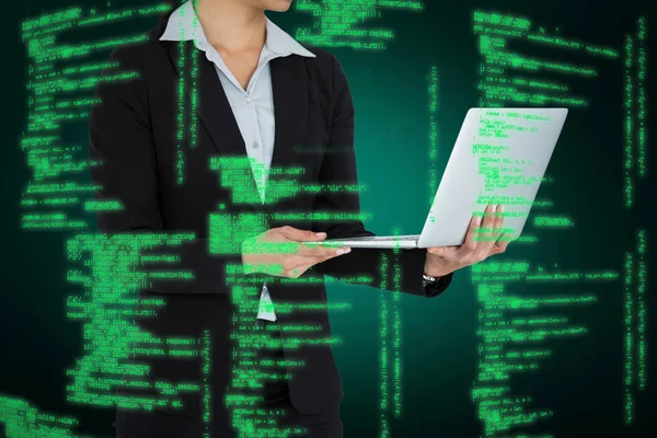 Composietbeeld van de bijgesneden afbeelding van zakenvrouw holding laptopcomputer — Stockfoto