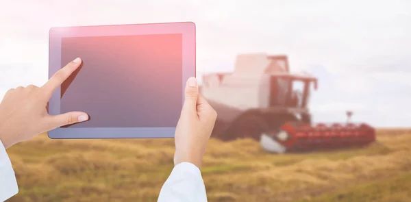 Composite image of doctor using tablet pc — Stock Photo, Image