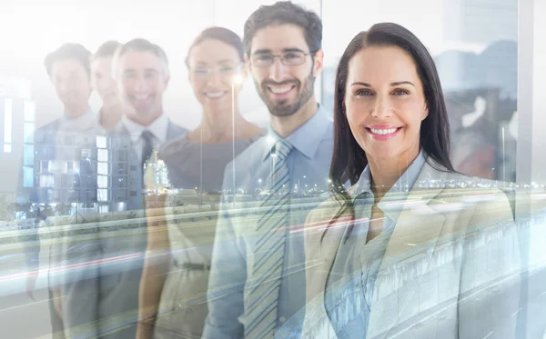 Smiling employees in a line — Stock Photo, Image