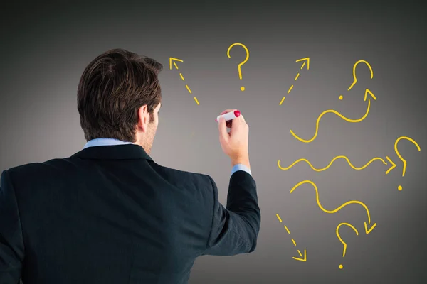 Composite image of rear view of businessman standing and writing — Stock Photo, Image